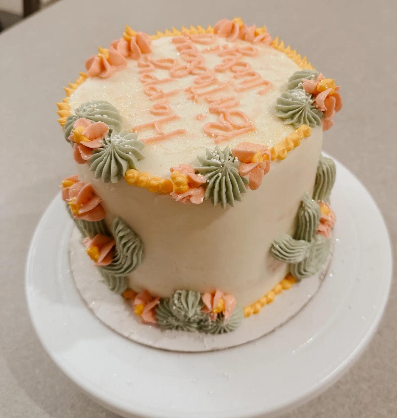 Buttercream wedding cake with floral piping