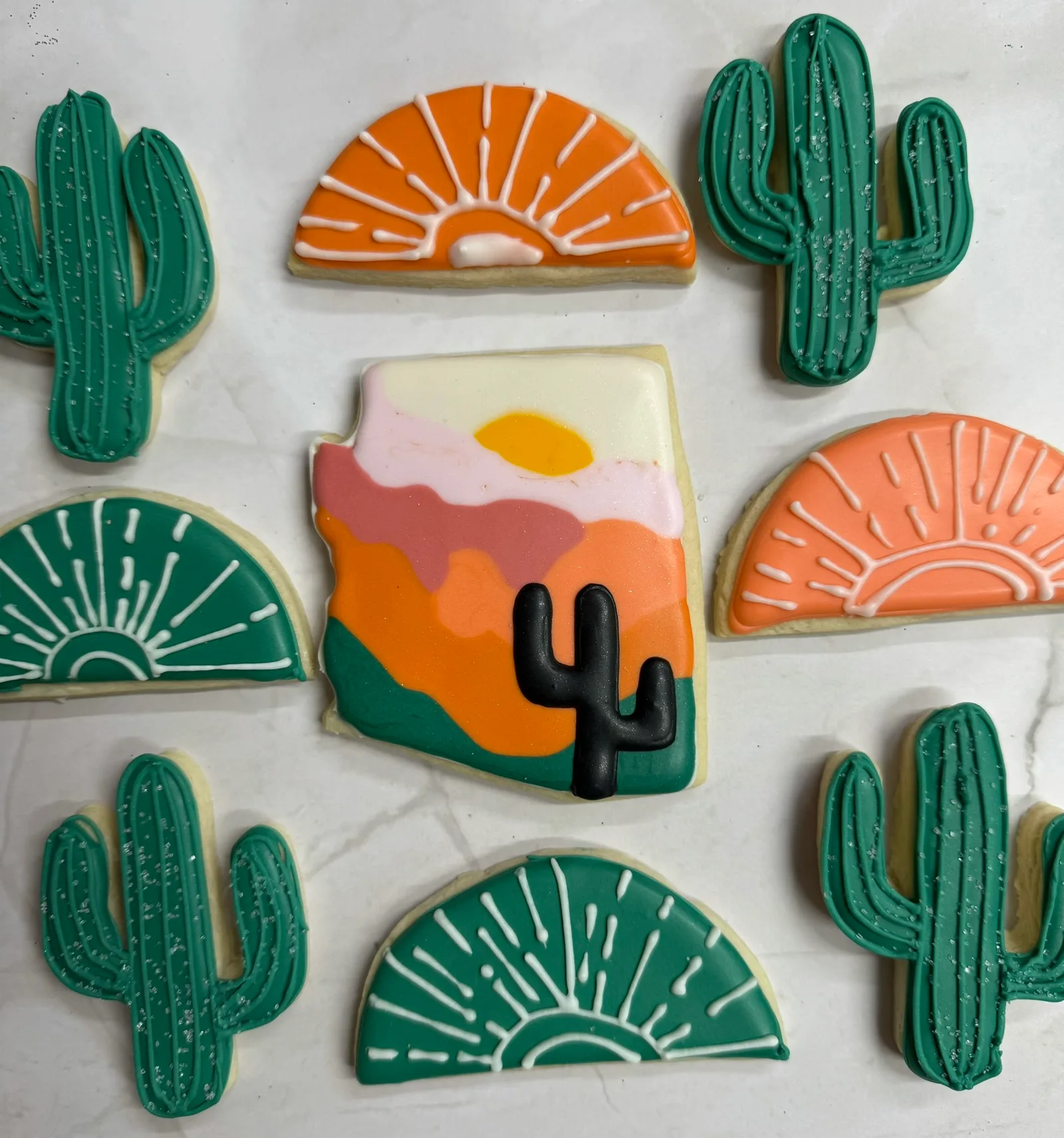 Desert sunset bridal shower — cacti & sun arches