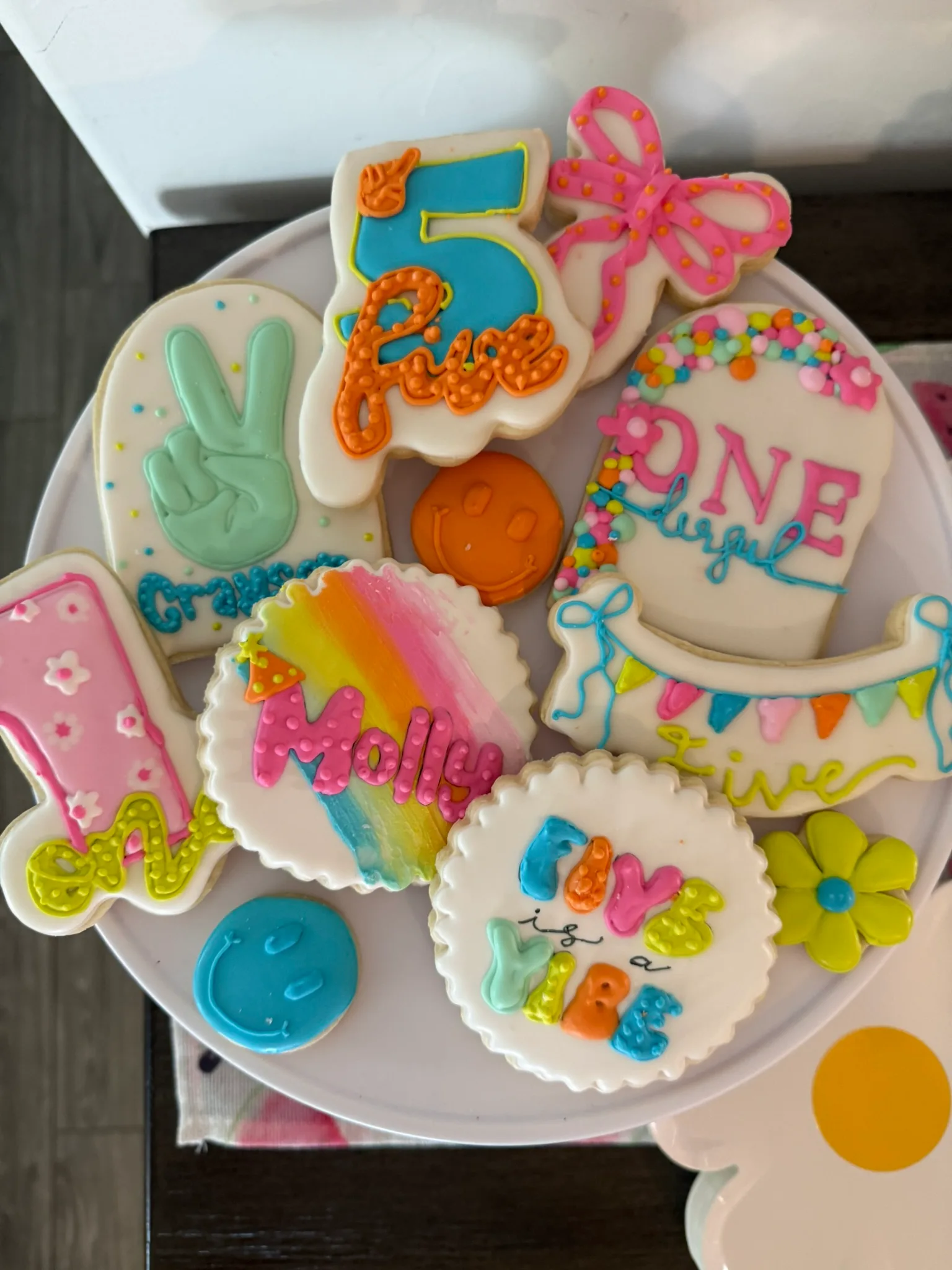 First-birthday cookie mix — pastels, ONE & friends