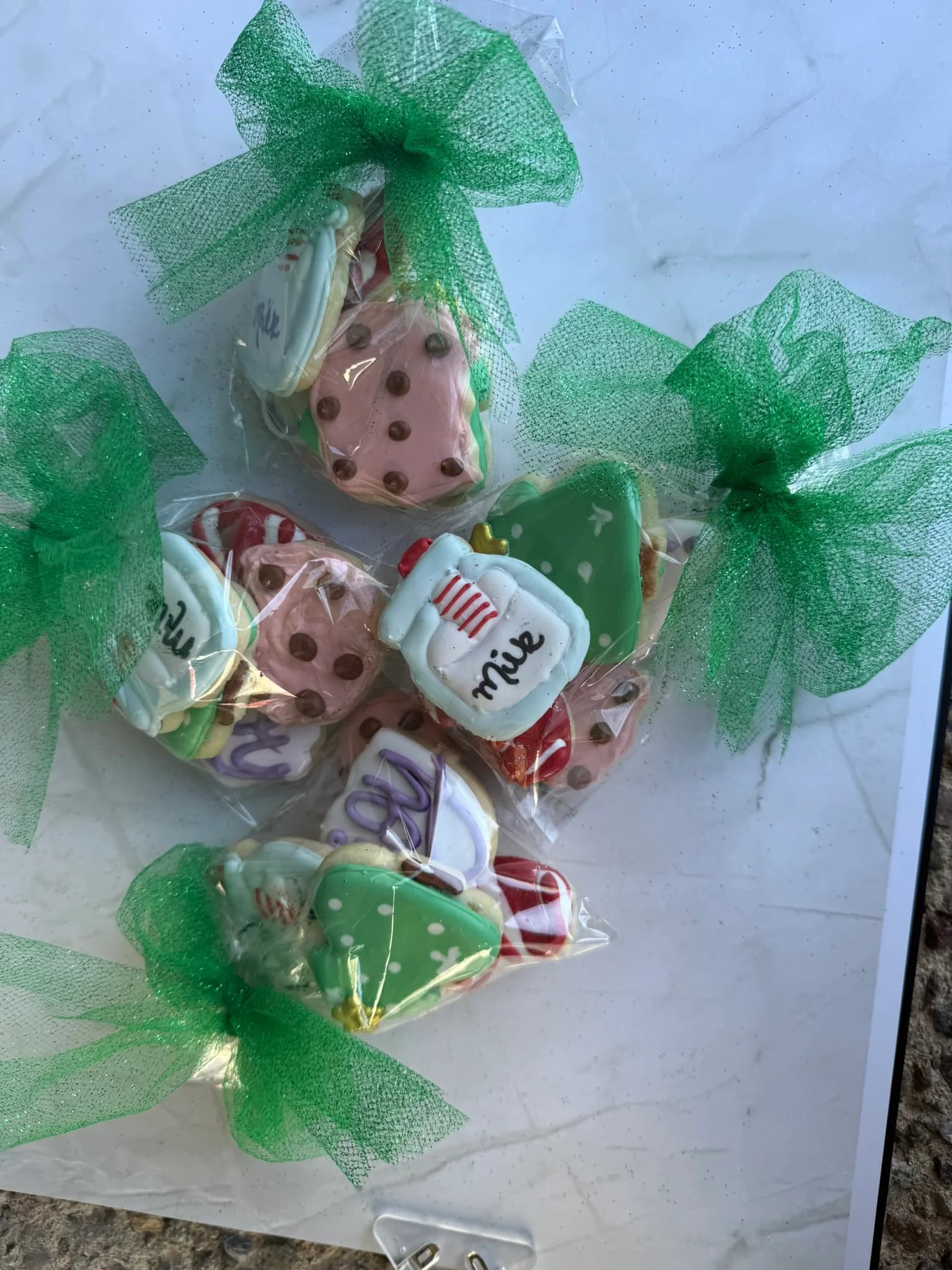 Cookie favor bags wrapped in green tulle